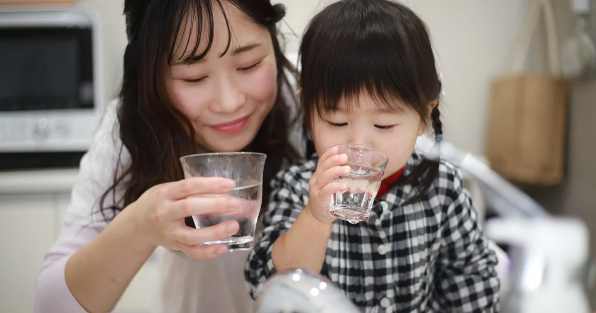 Family enjoying clean drinking water from home filtration system